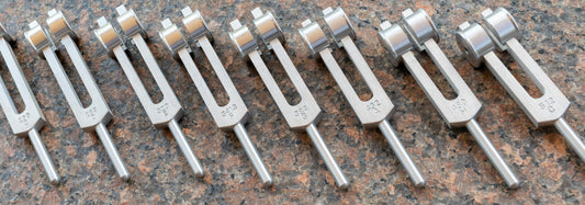 Selection of eight aluminium tuning forks all different frequencies, sound healing tools