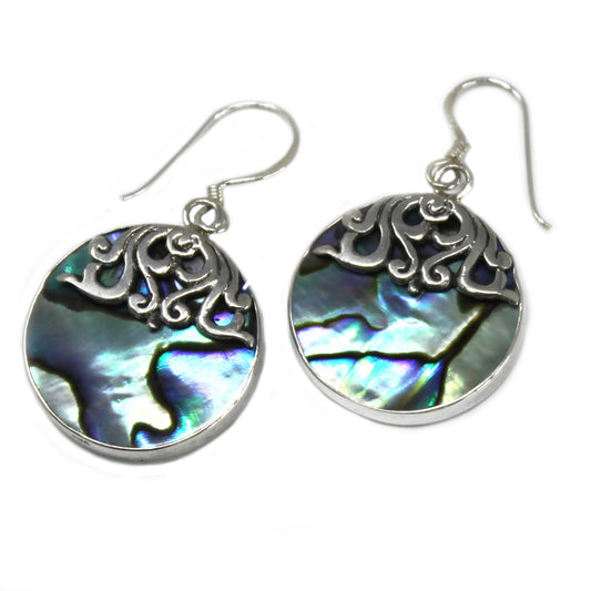 "Round abalone shell earrings with silver border and intricate swirl overlay at the top, handcrafted in Bali."