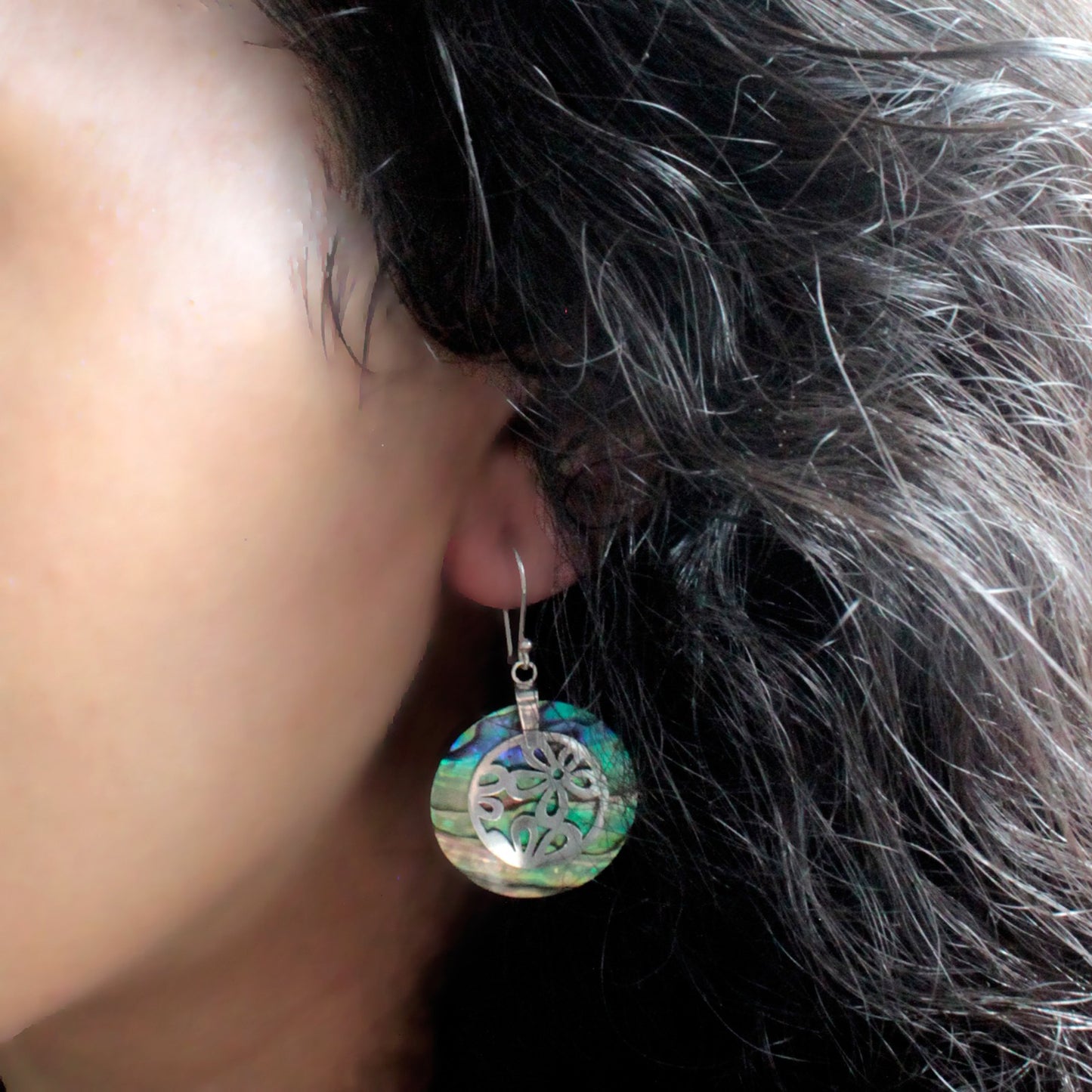 "Full round abalone shell earrings with ornate sterling silver floral overlay, handcrafted in Bali."