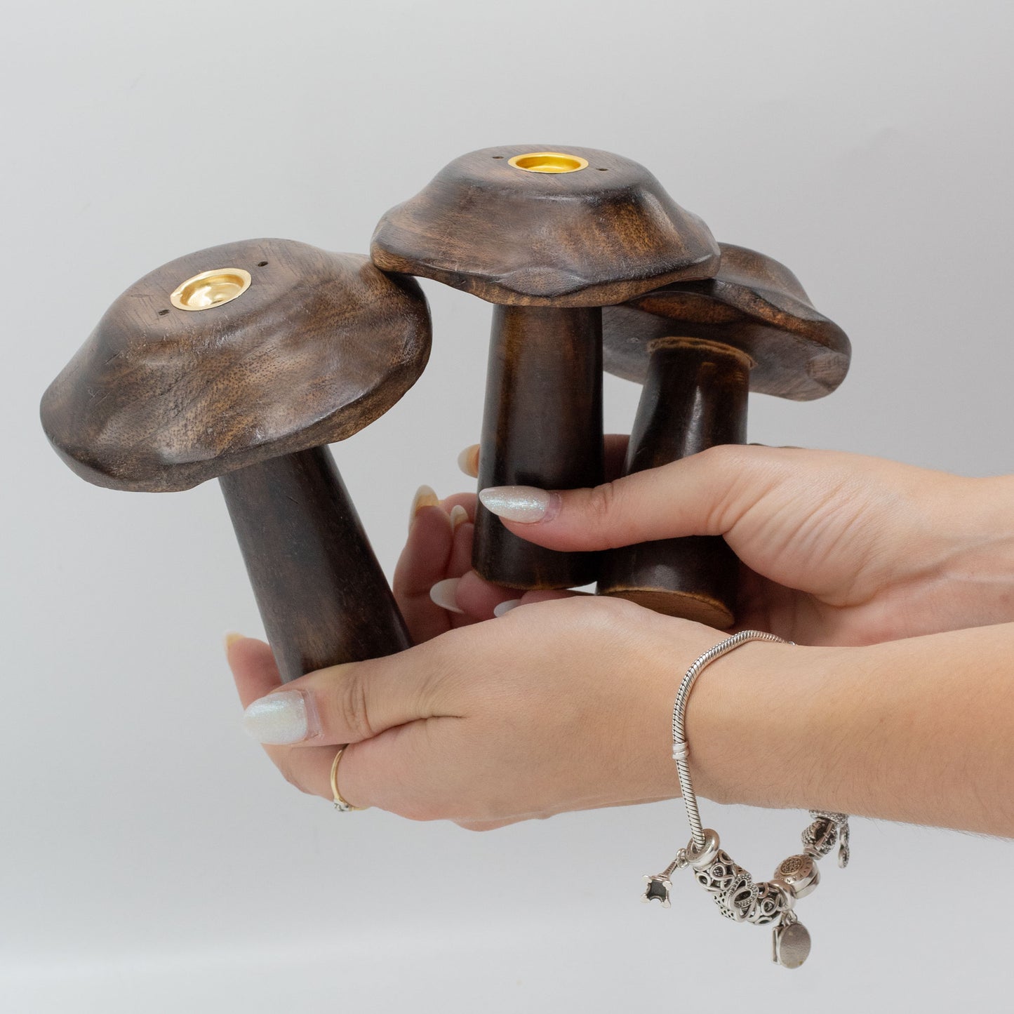 Set of 3 handcrafted mango wood flat mushroom incense holders with brass plates in 13cm, 12cm, and 11cm sizes for cone burning and natural décor.