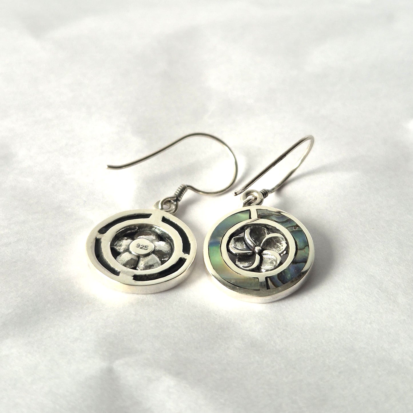 "Round abalone shell earrings with silver Frangipani flower center and sterling silver frame, handmade in Bali."