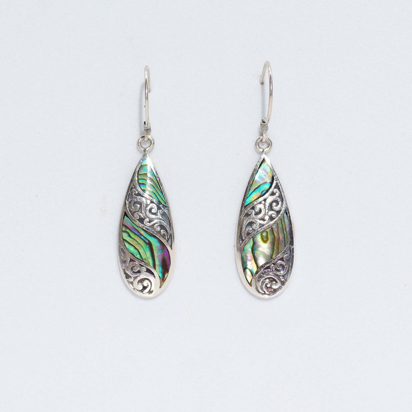 "Long teardrop earrings with abalone shell inlay and ornate sterling silver filigree, handcrafted in Bali."
