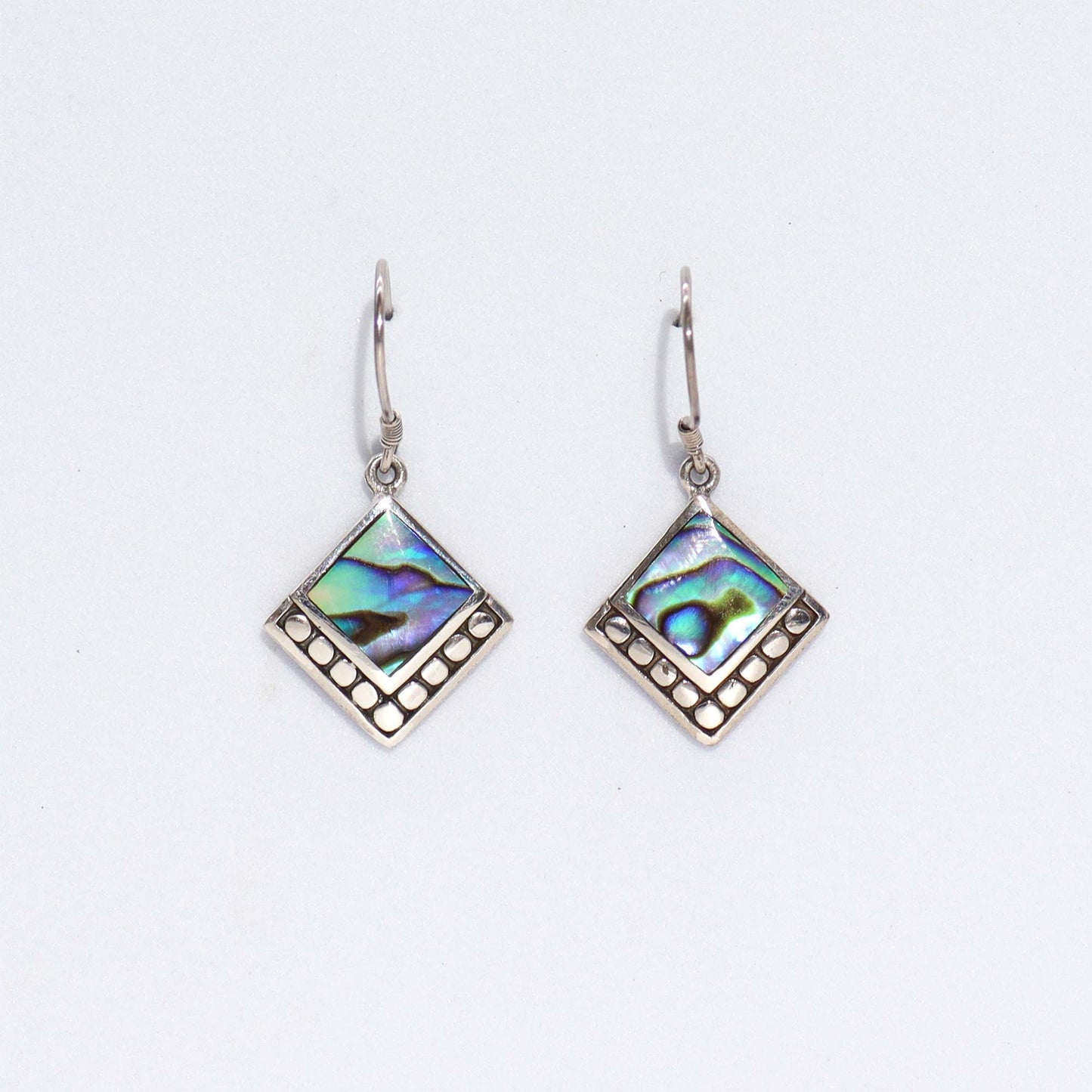 "Small square abalone shell earrings with dotted sterling silver border, handcrafted in Bali."