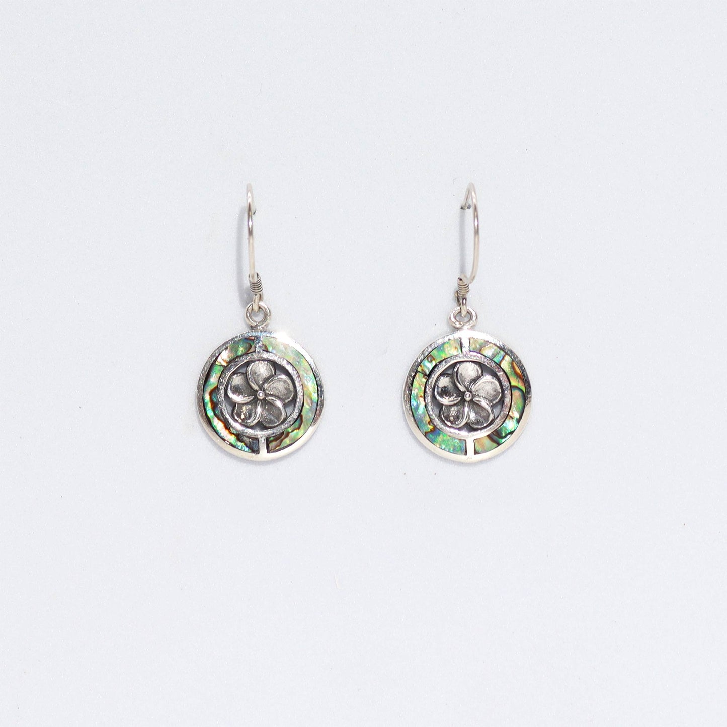 "Round abalone shell earrings with silver Frangipani flower center and sterling silver frame, handmade in Bali."