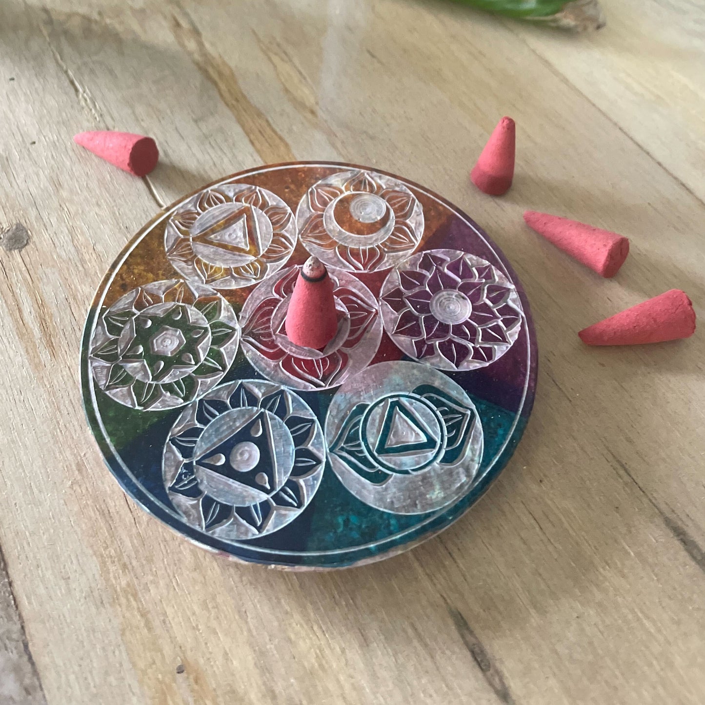 10cm soapstone incense cone holder with colorful carved Seven Chakra symbols, ideal for spiritual rituals and calming décor.