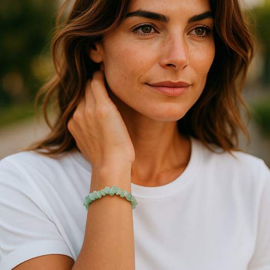 Green Aventurine chip stone bracelet, worn by a woman with brown hair and white shirt, symbolising prosperity, confidence, and emotional growth.