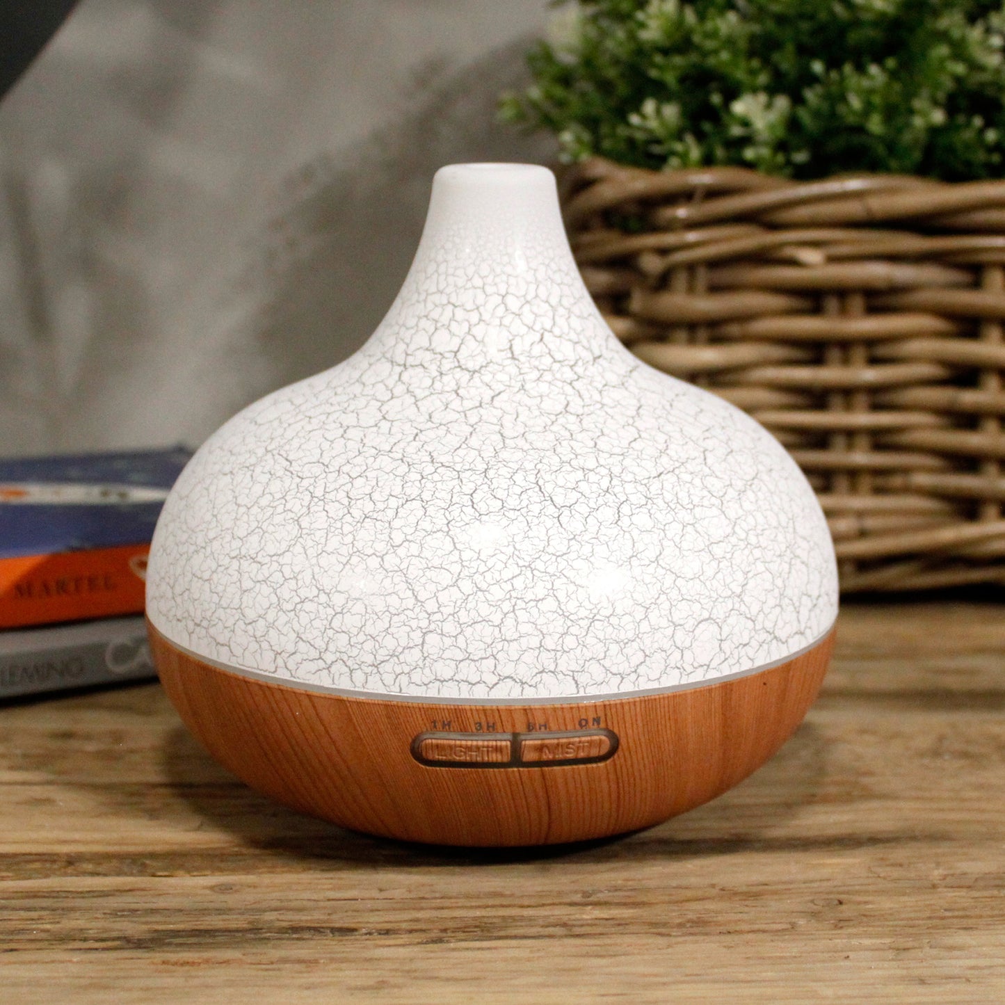 Santorini shell-inspired USB aroma diffuser with colour-changing LED, ultrasonic misting, and timer function for stylish home aromatherapy.