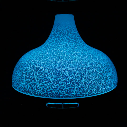 Santorini shell-inspired USB aroma diffuser with colour-changing LED, ultrasonic misting, and timer function for stylish home aromatherapy.