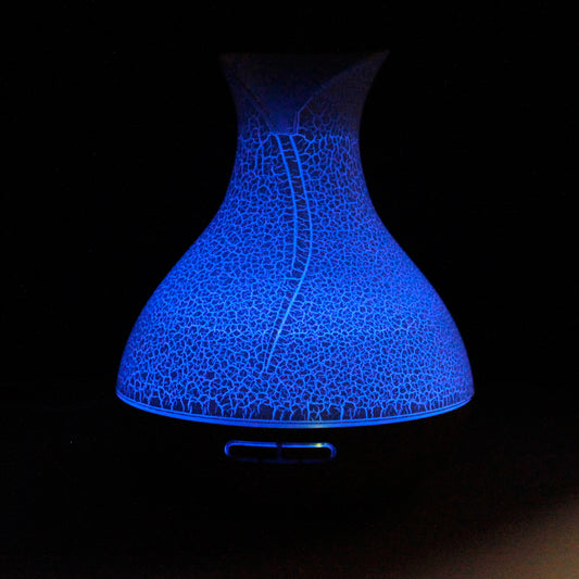 Palma shell-textured USB aroma diffuser with colour-changing light, ultrasonic mist, and timer for home aromatherapy and relaxation.