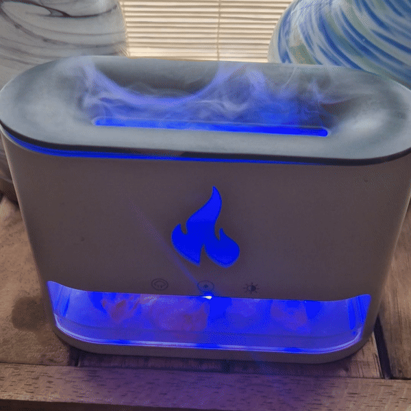 White Blaze aroma diffuser with glowing Himalayan salt chamber and USB power, featuring colour light and ultrasonic mist for peaceful ambiance.