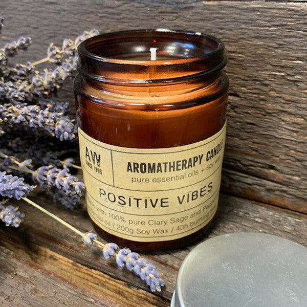 Positive Vibes soy wax aromatherapy candle with Clary Sage and Peppermint in amber jar