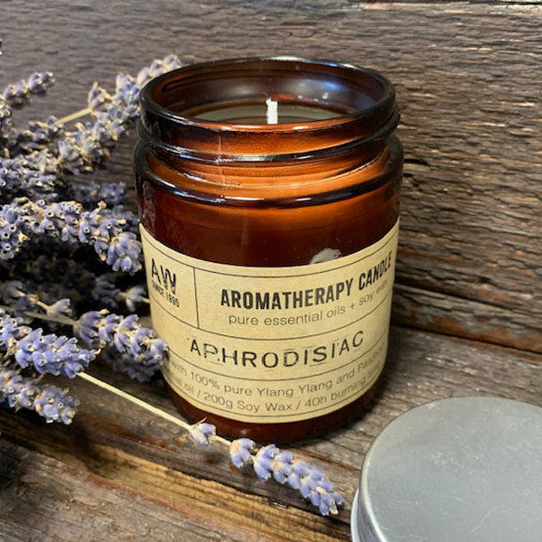 Aphrodisiac soy wax aromatherapy candle with Ylang Ylang and Patchouli essential oils in amber jar