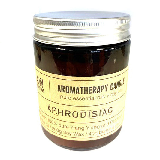 Aphrodisiac soy wax aromatherapy candle with Ylang Ylang and Patchouli essential oils in amber jar