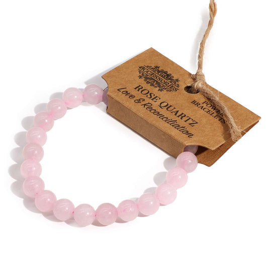 Rose Quartz power bracelet with soft pink 8mm beads, symbolising love, forgiveness, and emotional reconciliation.