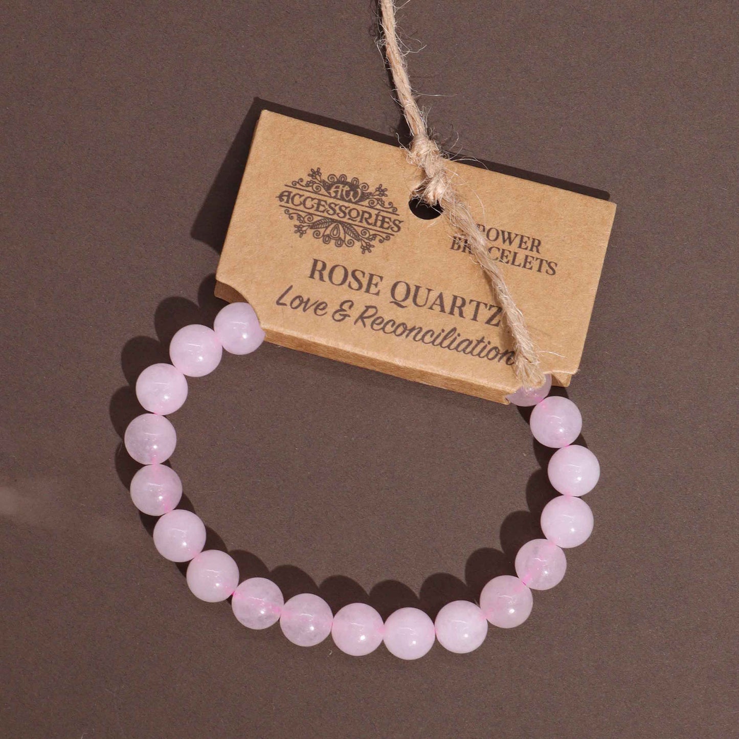 Rose Quartz power bracelet with soft pink 8mm beads, symbolising love, forgiveness, and emotional reconciliation.