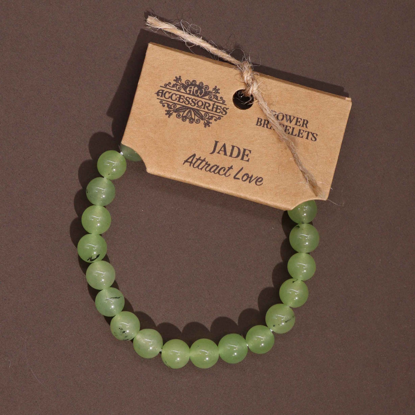 Jade power bracelet with soft green 8mm beads, symbolising love, harmony, and emotional balance.