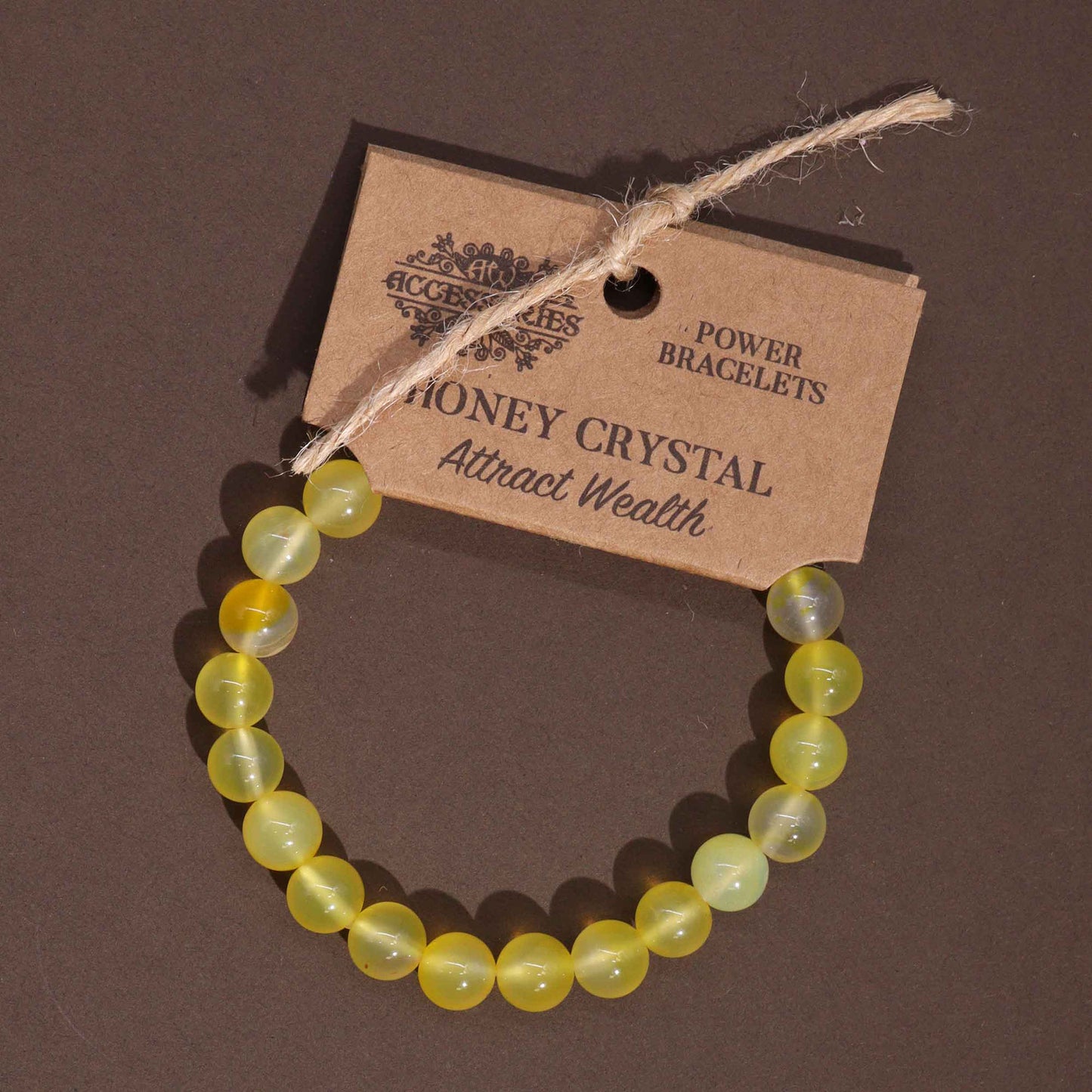 Honey Crystal power bracelet with golden 8mm gemstone beads, symbolising joy, creativity, and personal confidence.