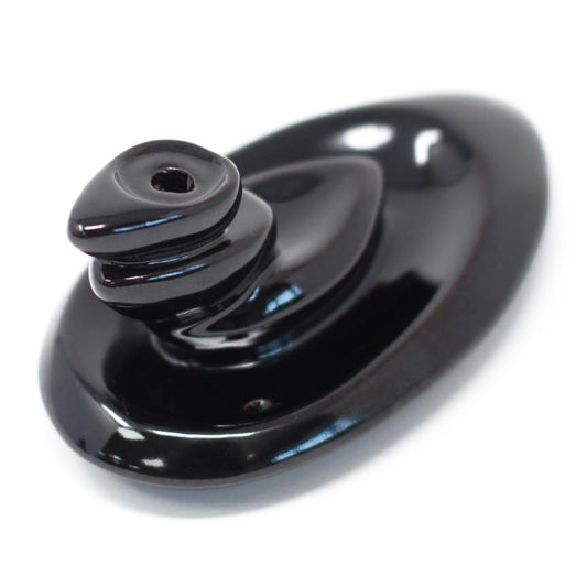 Small pebble-style backflow incense burner with cascading smoke trail, perfect for desks or minimalist meditation corners.