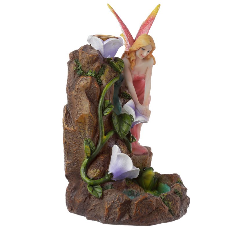 Fairy garden-themed backflow incense burner with flowing smoke, floral accents, and magical styling for fantasy-inspired interiors.