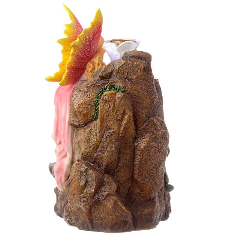Fairy garden-themed backflow incense burner with flowing smoke, floral accents, and magical styling for fantasy-inspired interiors.