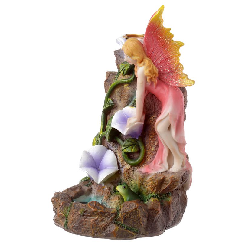 Fairy garden-themed backflow incense burner with flowing smoke, floral accents, and magical styling for fantasy-inspired interiors.