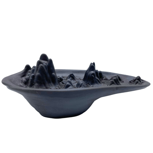 Mountain scape backflow incense burner with layered peaks and smoke waterfall effect. Nature-inspired spiritual décor piece.