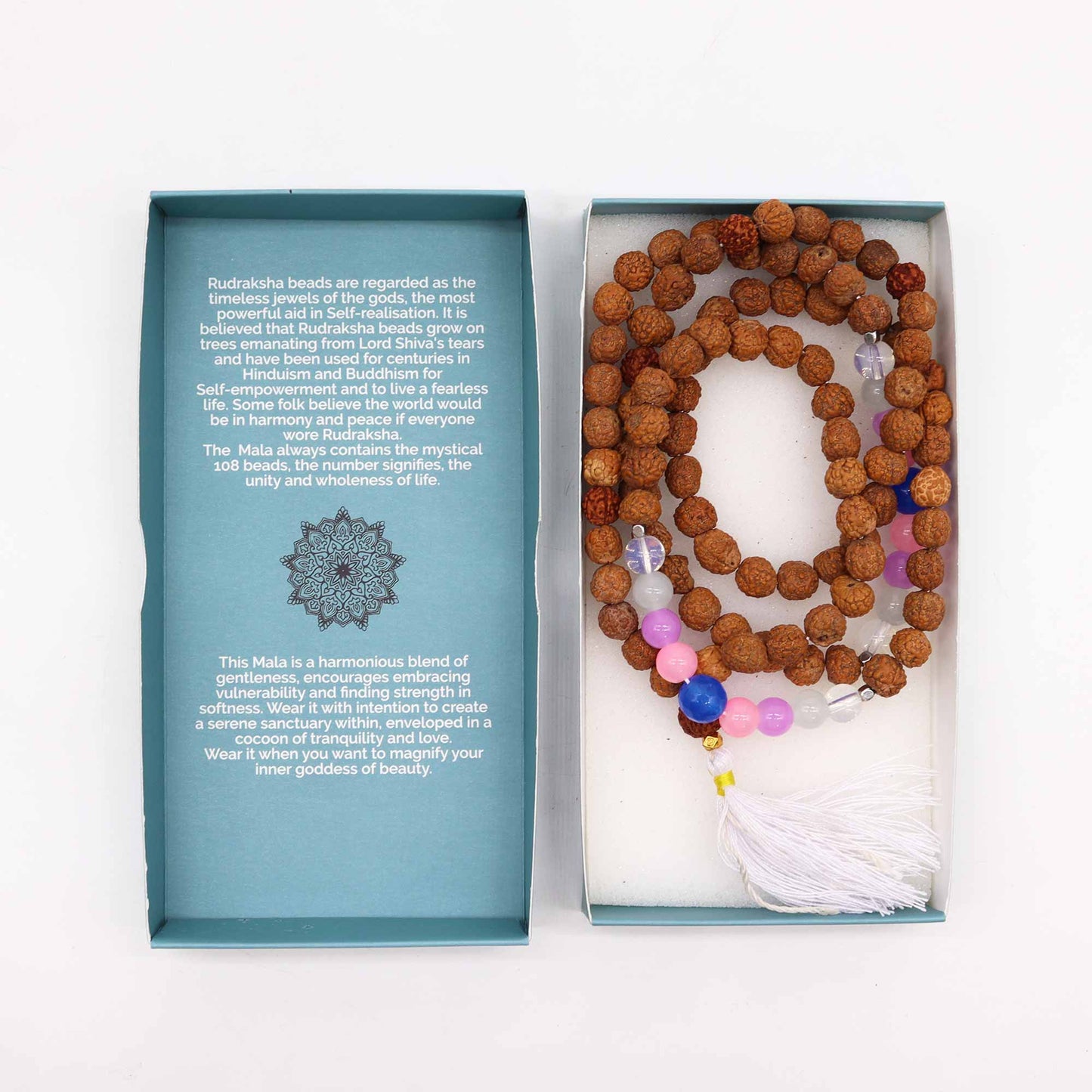 "Beauty Goddess Mala necklace with Rudraksha beads and soft-toned glass accents in pink, white, and blue, finished with a white tassel and gift box."