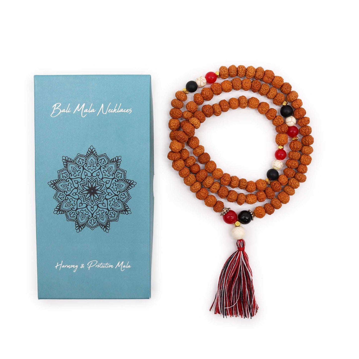 "Harmony & Protection Mala with Rudraksha beads and red, white, and black accents symbolising Tri Datu, finished with a three-colour tassel and gift box."