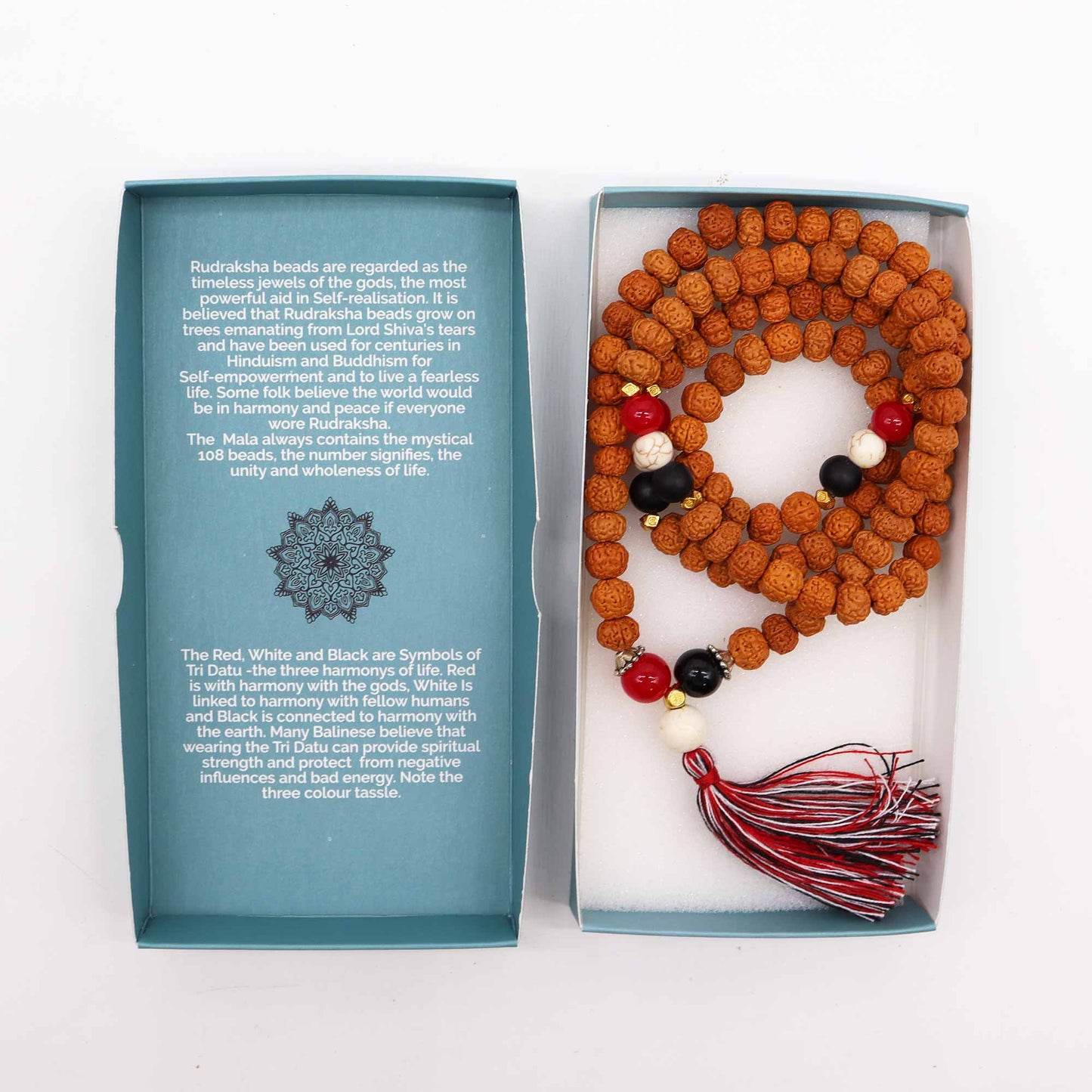 "Harmony & Protection Mala with Rudraksha beads and red, white, and black accents symbolising Tri Datu, finished with a three-colour tassel and gift box."