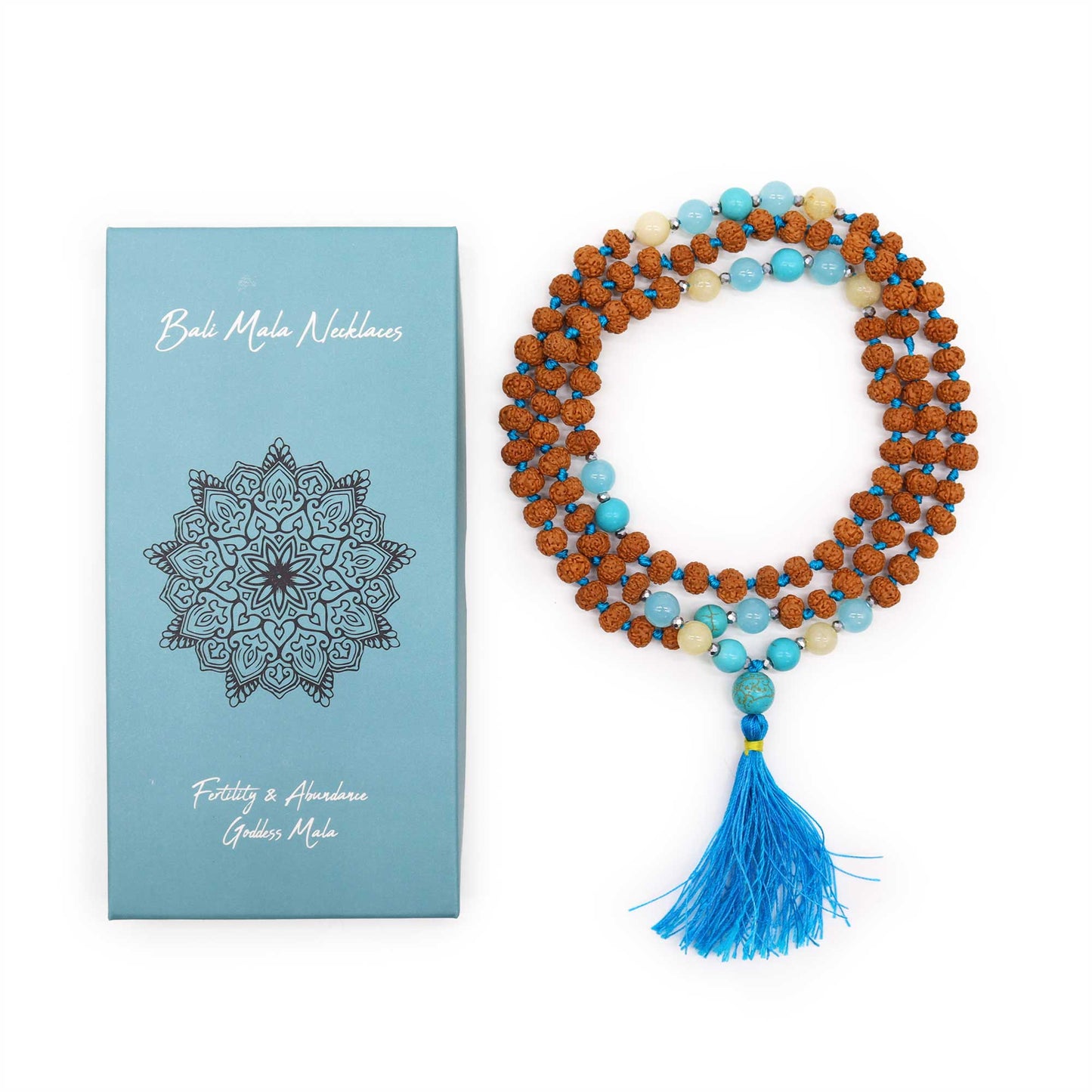 "Fertility & Abundance Mala necklace with Rudraksha and vibrant blue-toned glass beads, displayed with gift box and bright blue tassel."