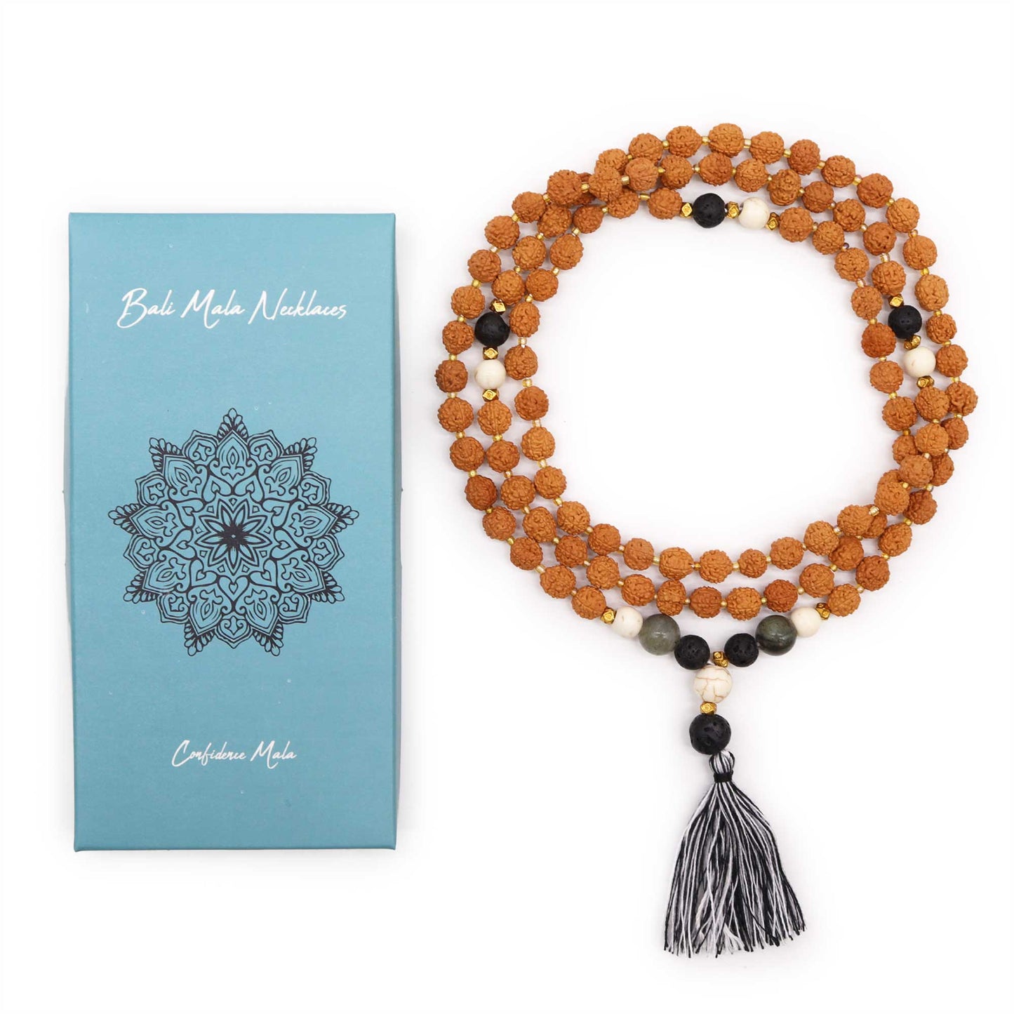 "Confidence Mala necklace made with Rudraksha and coloured glass beads, featuring a black and white tassel, displayed beside blue spiritual gift box."