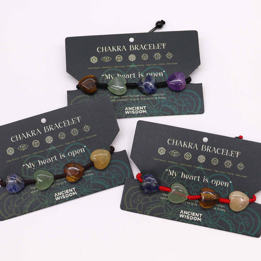 Chakra string bracelet with gemstone beads and “My heart is open” affirmation on adjustable cotton cord.