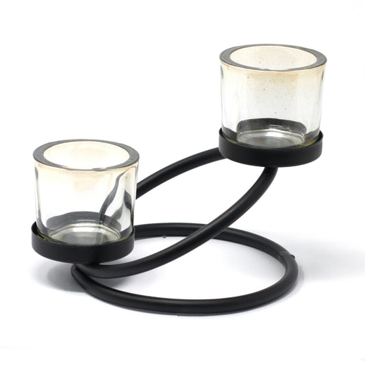Double iron votive candle holder with circular swirl base and amber glass – decorative lighting piece