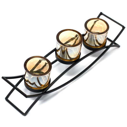 Triple iron votive candle holder with curved base and amber glass – modern centrepiece