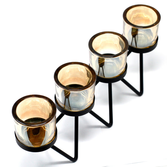 Quadruple iron votive candle holder with zigzag base and amber glass – modern decorative centrepiece