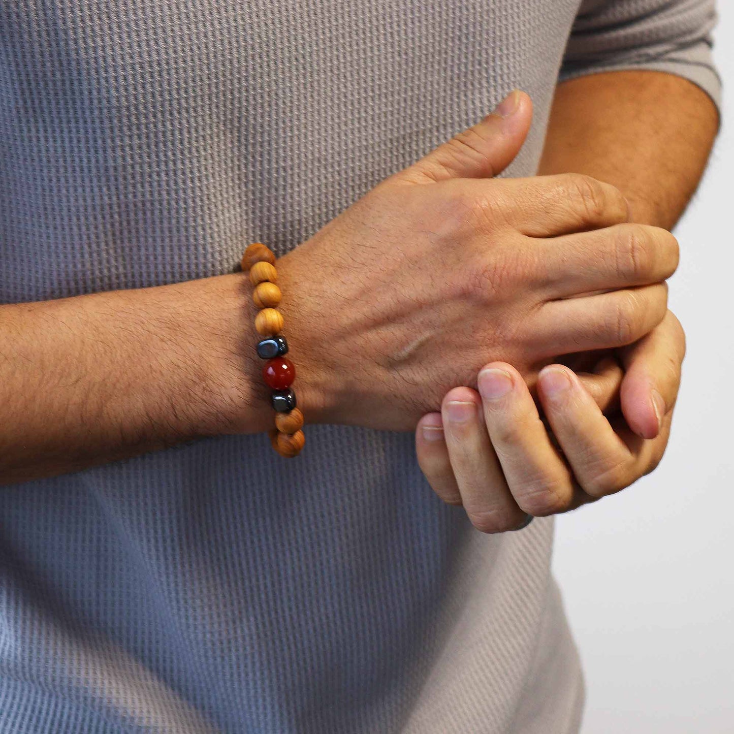 Cedarwood & Red Jasper Chakra Bracelet for Root Chakra. Supports strength, grounding, and stability. Includes info card and earthy aromatic balance.