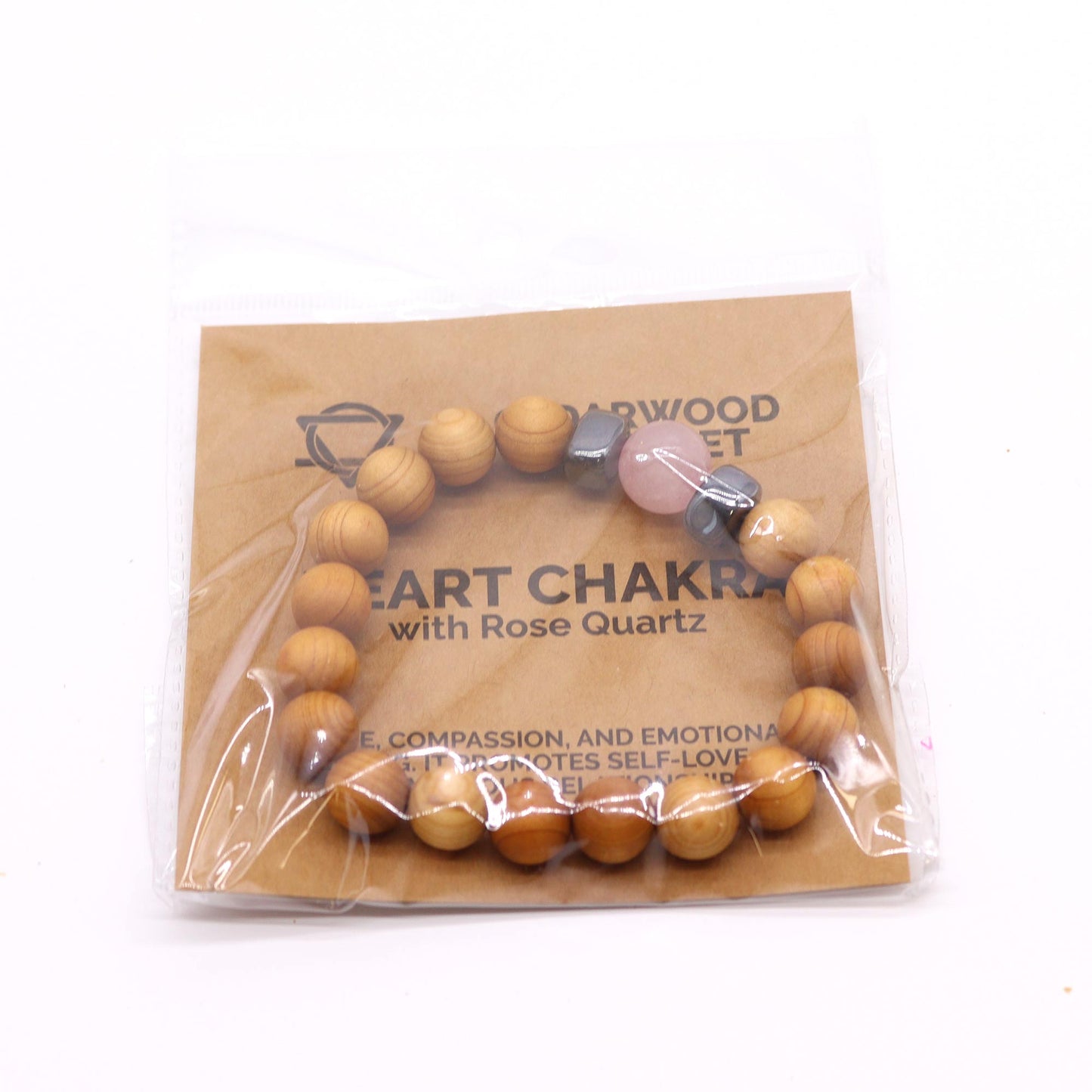 Cedarwood Chakra Bracelet with Rose Quartz for Heart Chakra, promoting love, healing, and emotional balance with grounding aroma.