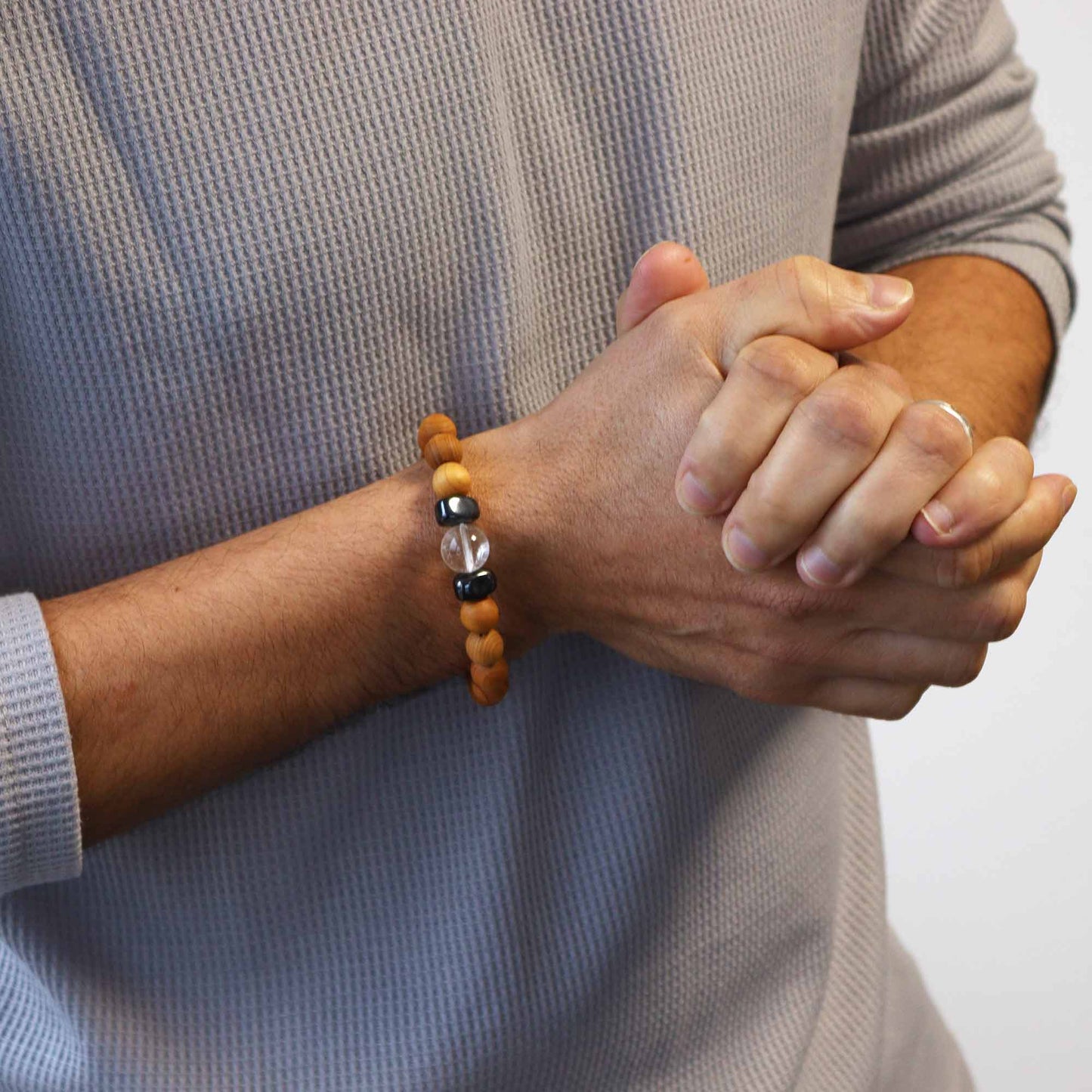 Cedarwood Chakra Bracelet with Clear Quartz for Crown Chakra, enhancing spiritual clarity and connection with soothing cedarwood aroma.