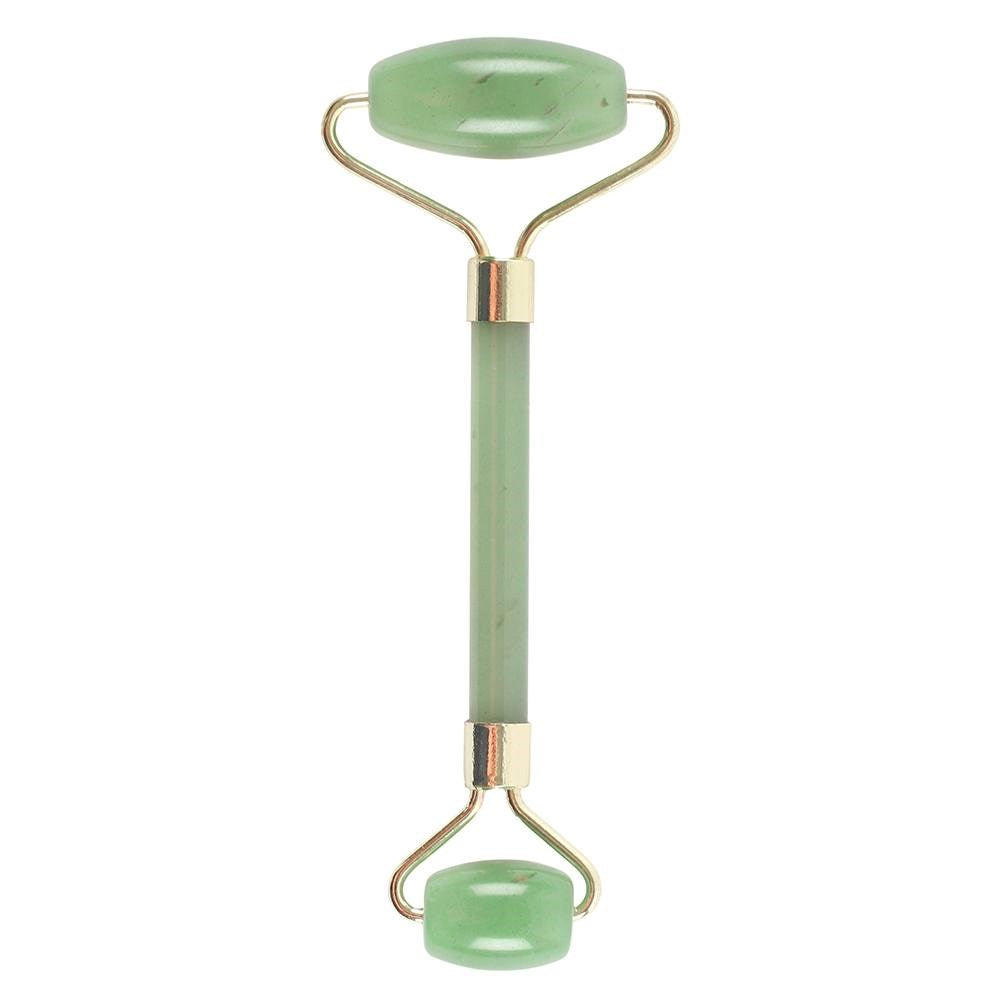 Jade crystal face roller inspired by Eastern traditions for skin balance and glow.
