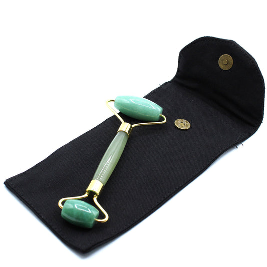 Jade crystal face roller inspired by Eastern traditions for skin balance and glow.
