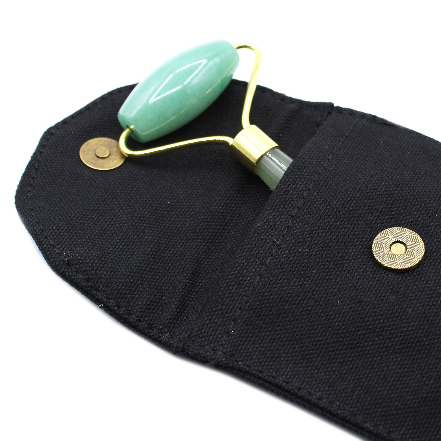 Jade crystal face roller inspired by Eastern traditions for skin balance and glow.