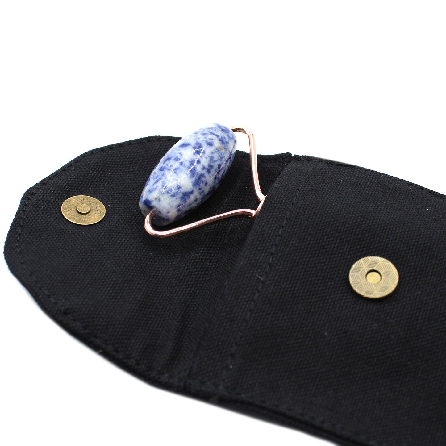 Sodalite crystal face roller with calming blue stone for skin clarity and facial massage.