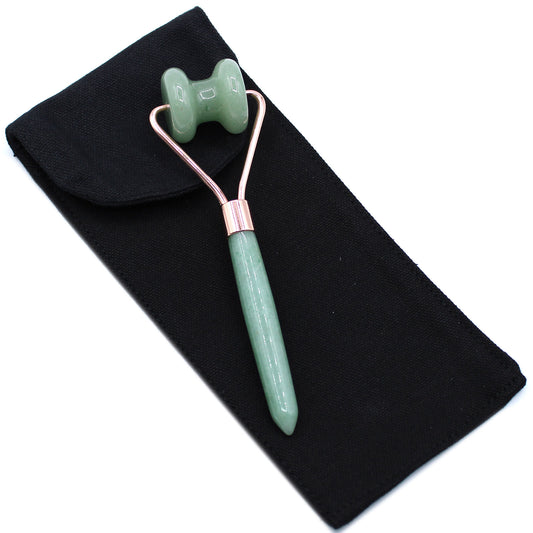Jade crystal jawline roller shaped for facial contouring and harmony in skincare.