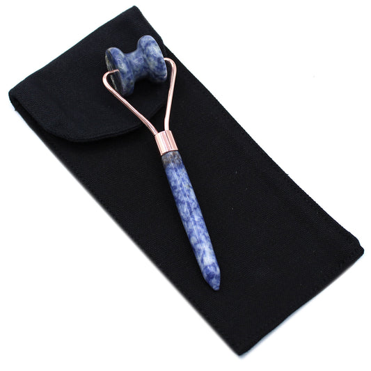 Sodalite jawline roller in deep blue crystal for calming tension and defining jawline.
