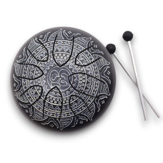 Steel tongue drum in black with engraved Om mandala design – 16cm, 8-note layout with mallets for meditation and sound healing.