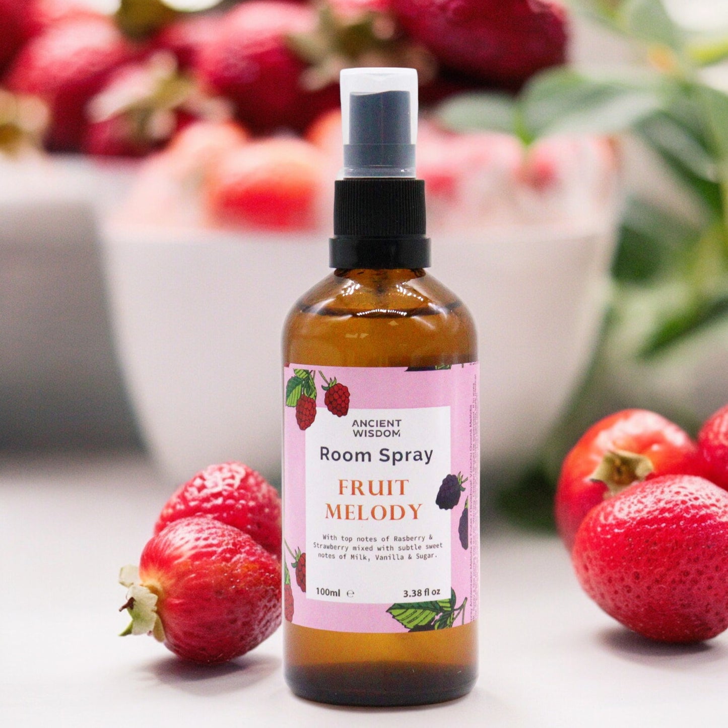 Amber bottle of Fruity Melody room spray – 100ml, with berry fragrance notes and natural ingredients.