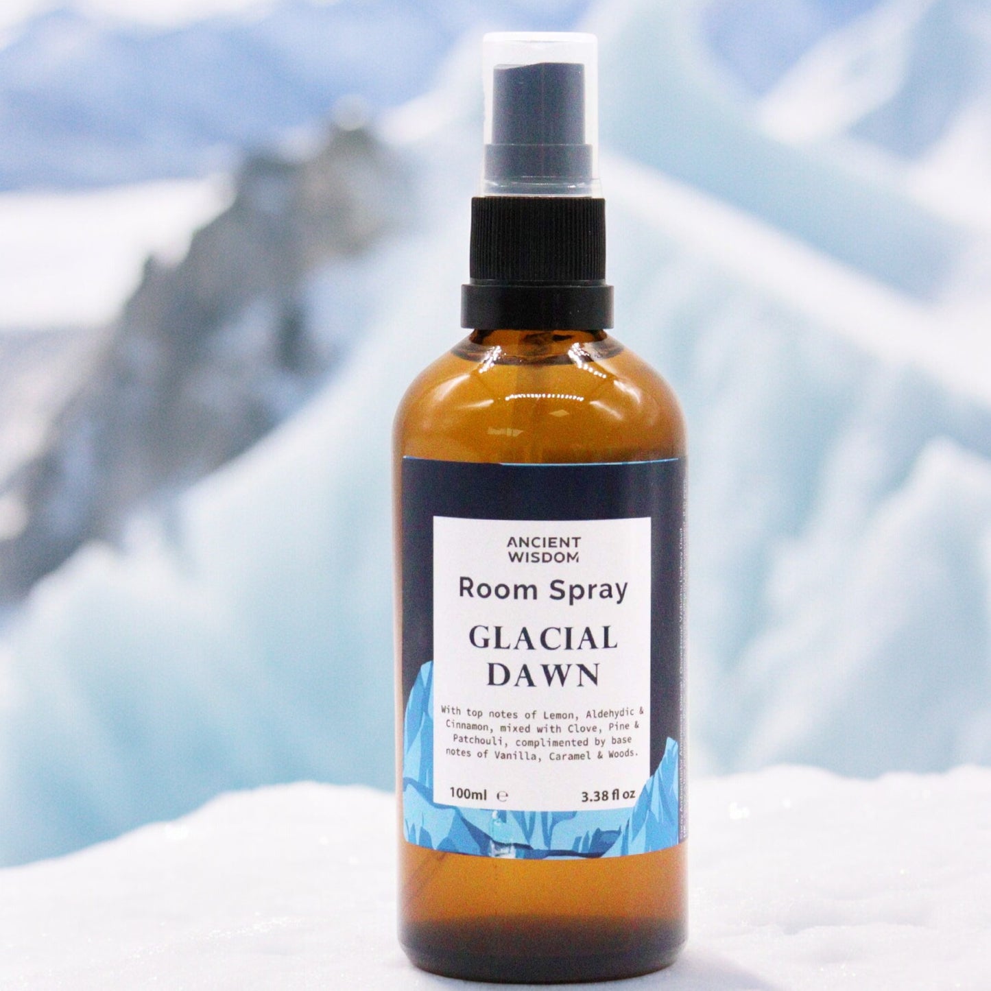 Amber glass bottle of Glacial Dawn room spray – 100ml, featuring a citrusy, spicy, and woody aroma blend.
