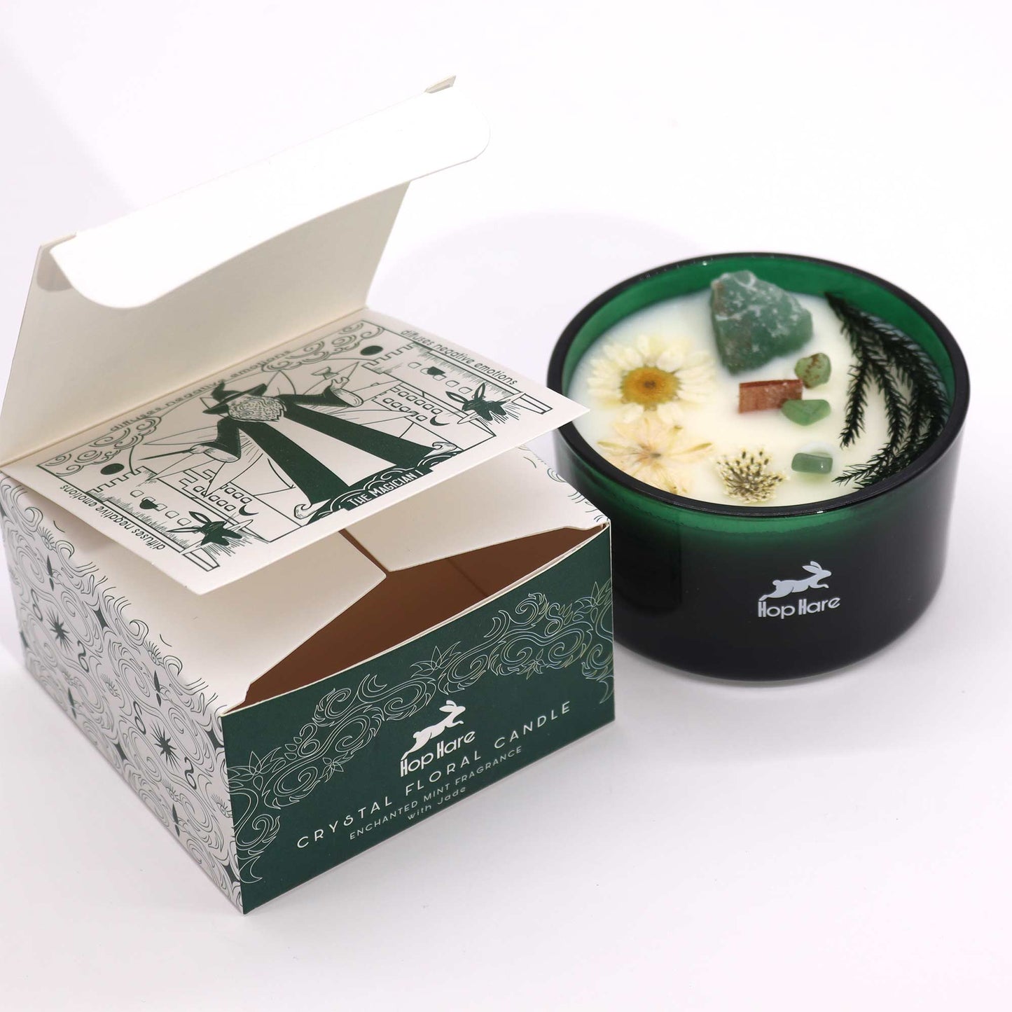 Hop Hare The Magician crystal candle with jade, dried flowers, and tarot card in dark green jar