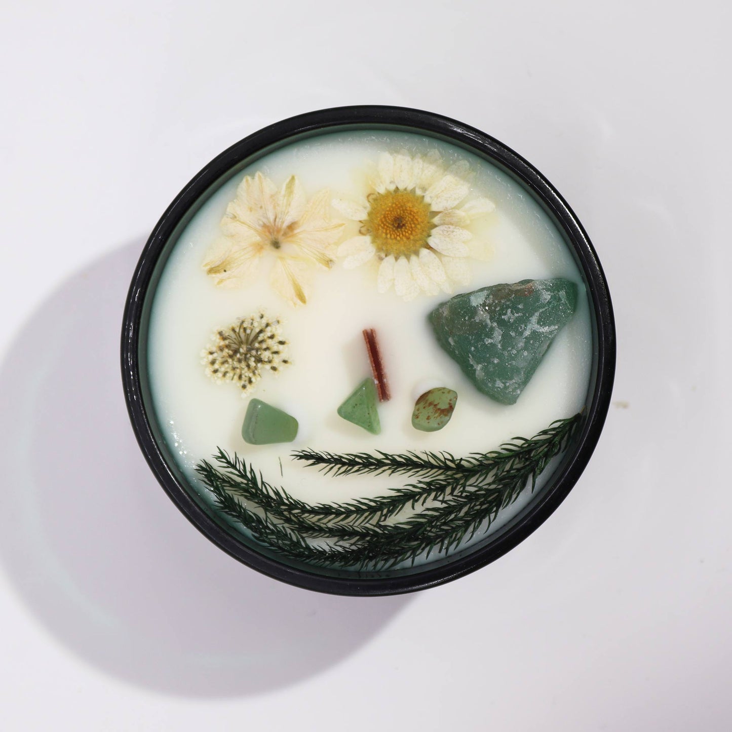 Hop Hare The Magician crystal candle with jade, dried flowers, and tarot card in dark green jar