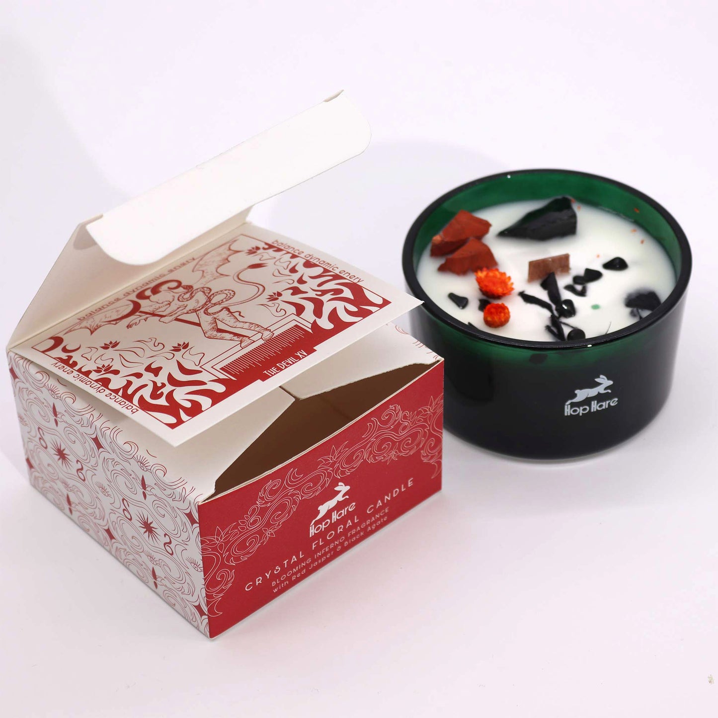 Hop Hare The Devil crystal candle with red jasper, black agate, dried flowers, and tarot card in dark green jar